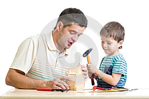 Dad and son kid tinkering nesting box