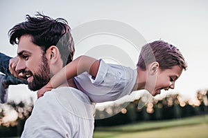 Dad and son outdoors photo