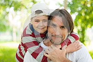 Dad and son at the park in summer