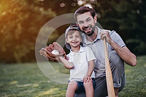 Dad with son playing baseball