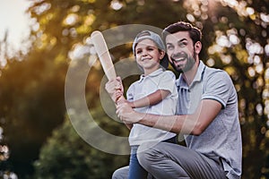 Dad with son playing baseball