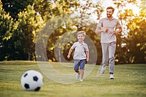 Dad with son playing baseball