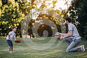 Dad with son playing baseball