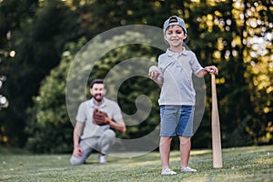 Dad with son playing baseball