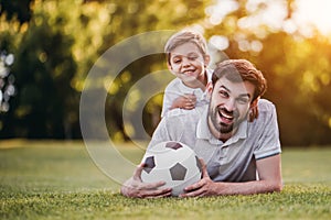 Dad with son playing baseball