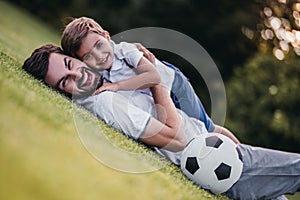 Dad with son playing baseball