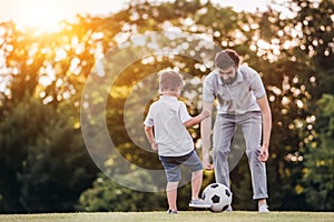 Dad with son playing baseball