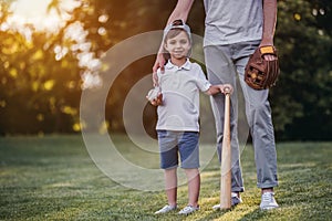 Dad with son playing baseball