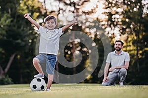 Dad with son playing baseball