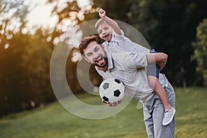 Dad with son playing baseball