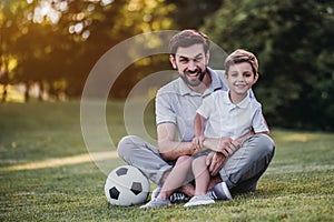 Dad with son playing baseball