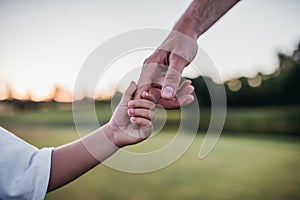 Dad with son playing baseball