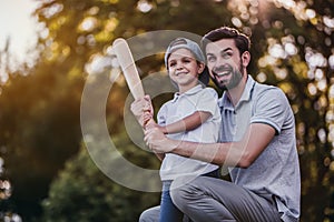 Dad with son playing baseball photo