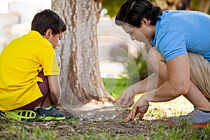 Dad and son playing with marbles