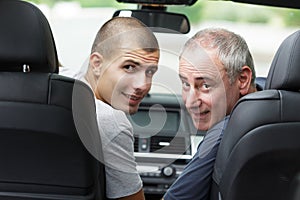 Dad and son reversing car