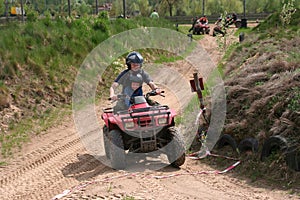 Dad with son riding a quad