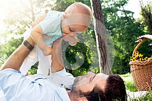 Dad and son spending time outdoor on a summer day