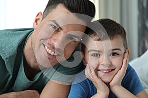 Dad and son spending time together at home. Happy Father`s Day