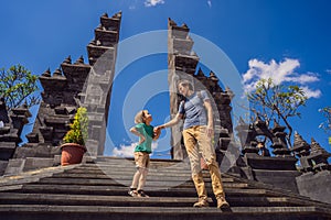 Dad and son tourists in budhist temple Brahma Vihara Arama Banjar Bali, Indonesia. Honeymoon