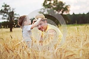 Dad with son walking in a field