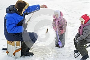 Dad spends his free time on the winter fishing