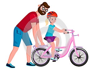 Dad teaches daughter to ride a bike