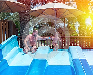 Dad teaches a little daughter to swim