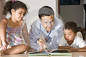 Dad teaching children