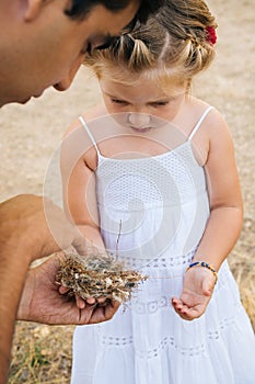 Dad teaching daughter about nature