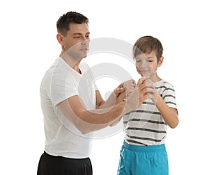 Dad teaching his son to fight isolated