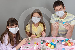 Dad and two quarantined girls paint Easter eggs