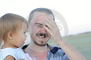 Daddy with daughter laughing