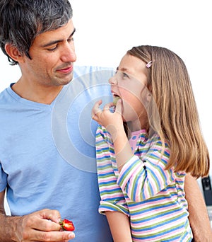 Daddy with his daughter in the kitchen