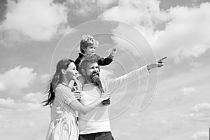 Daddy, mommy and child son. Happy family - child son playing with paper airplane. Portrait of happy father giving son