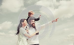 Daddy, mommy and child son. Happy family - child son playing with paper airplane. Portrait of happy father giving son