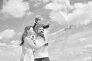 Daddy, mommy and child son. Happy family - child son playing with paper airplane. Portrait of happy father giving son