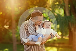 Daddy playing active games with his son outside