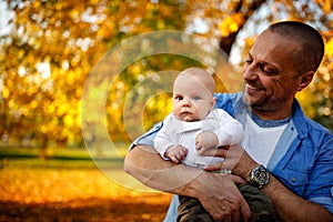 Daddy with son playing and having fun in the park