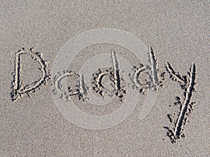 `daddy` is written on the sand