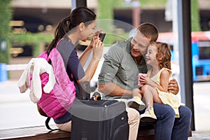 Daddys girl and mommys world. A family taking pictures at the beginning of their holiday.