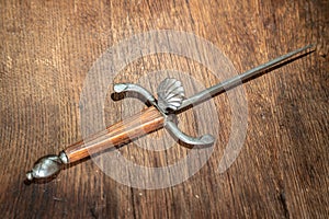 Dagger Ancient and old on wooden background