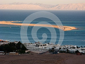 Dahab's spit and distant mountains photo