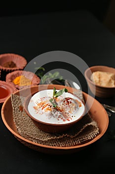 Dahi vada is famous fast food in India and specially eaten on Holi Festival. (Holi concept food)