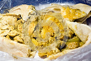 Dahl pouri chicken roti trinidad food photo