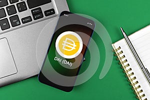 DAI symbol. Trade with cryptocurrency, digital and virtual money, banking with mobile phone concept. Business workspace