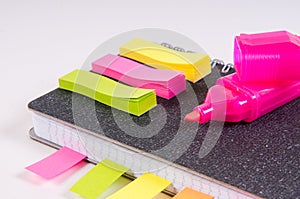 Dairies notepad with stickers and soft-tip pens on wooden background
