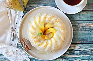 Dairy dessert. Rice pudding with baked pears, cinnamon and honey