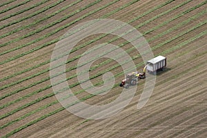 Dairy Farmer Cutting Hay Tractor Field Aerial View