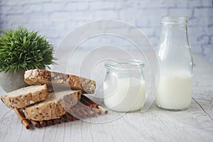 dairy fresh milk and brown bread on table
