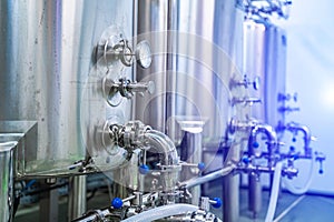 Dairy production. Apparatus for bottling milk products. Steel tanks at milk factory